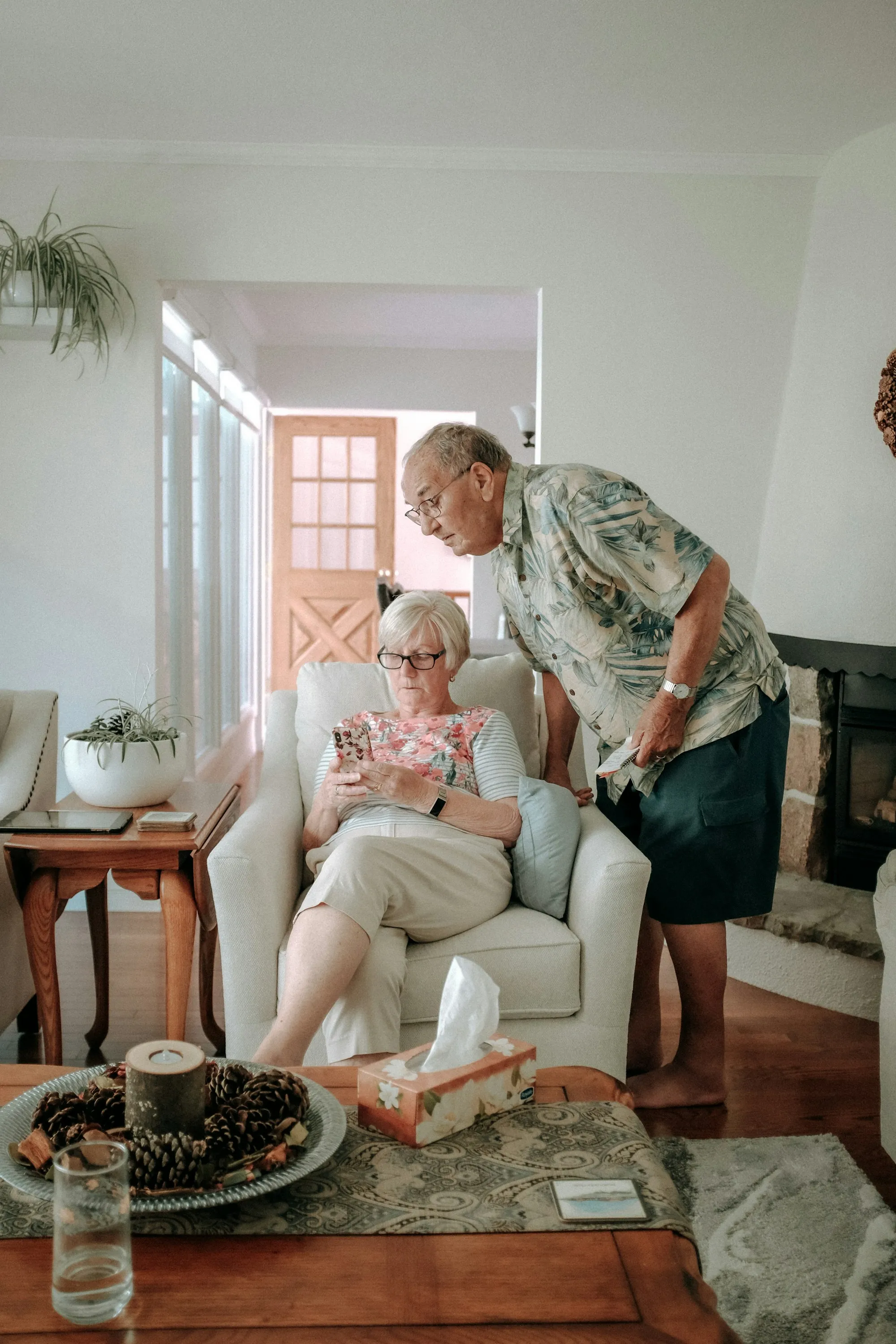 Two people talking together in a living room